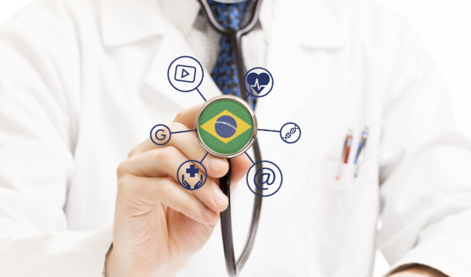 Telemedicina: médico segurando um estetoscópio com a imagem da bandeira do Brasil e alguns símbolos dos meios digital e médico ao redor 